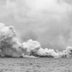 Steam produced by molten lava pouring into the North Pacific Ocean.